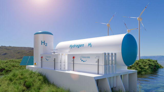 Réservoirs d’hydrogène photographiés devant des éoliennes