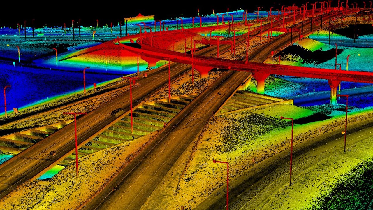 Image en nuage de points LiDAR à reflets arc-en-ciel représentant des rues et des ponts